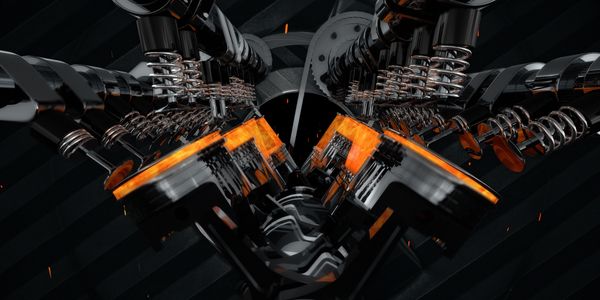 Close-up of a V8 engine with pistons and valves in motion.