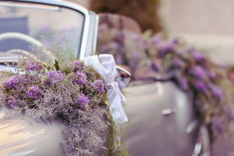 Wedding car adorned with flowers