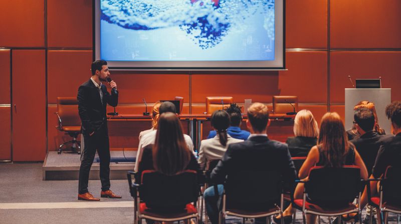 Public speaker at science convention.