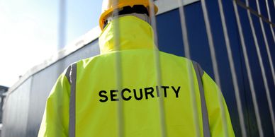 Security personnel wearing a high-visibility jacket.