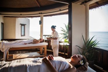 Women relaxing in oceanside spa