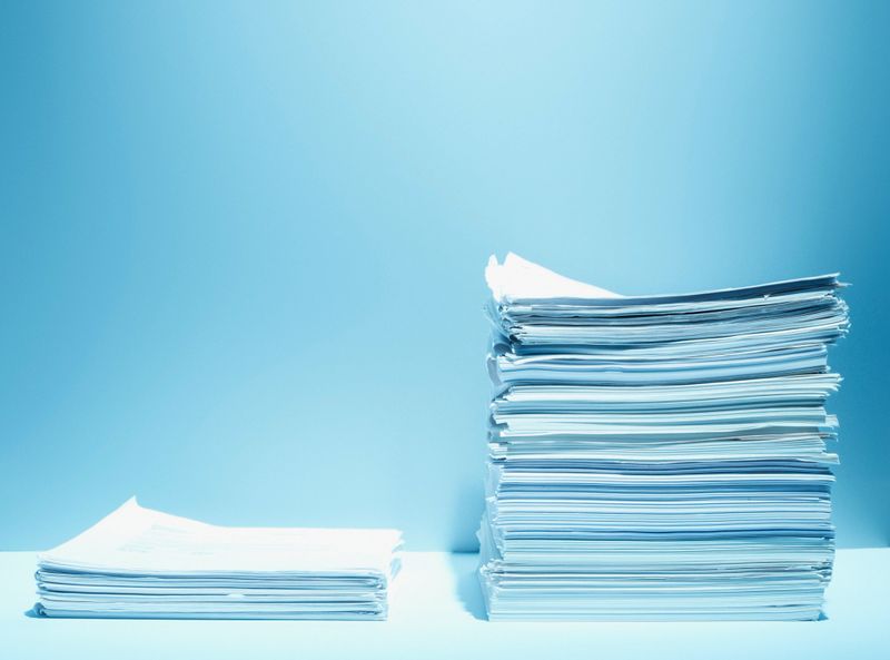 Tall and short stacks of paper