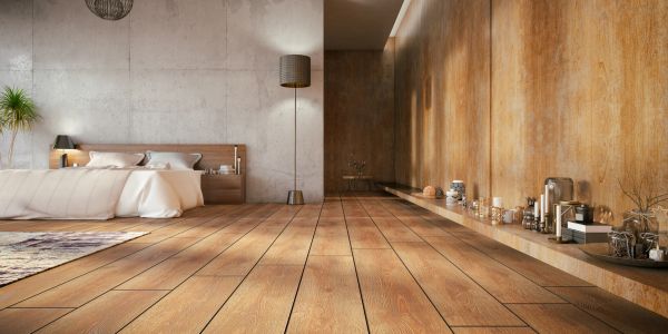 Dormitorio moderno con decoración cálida y suelo de madera.