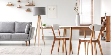 Modern living room with wooden furniture and neutral tones.