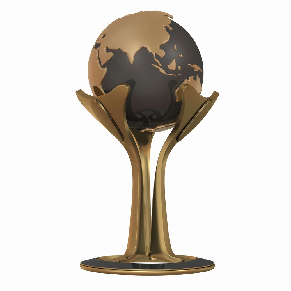 Golden globe trophy featuring continents on a black sphere.