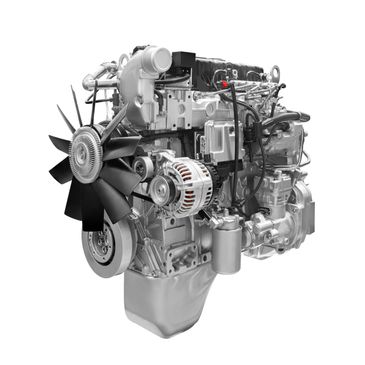 A detailed view of a modern engine with fan and alternator.