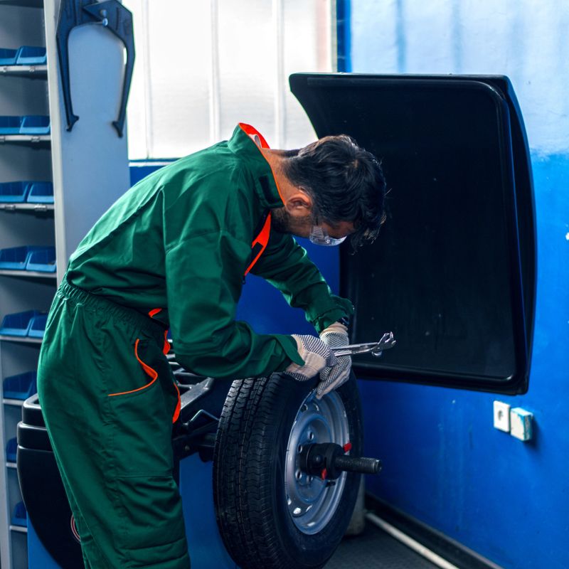 Mechanic man working on balancing machine