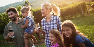a family drinking wine