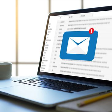 Laptop screen showing a new email notification.