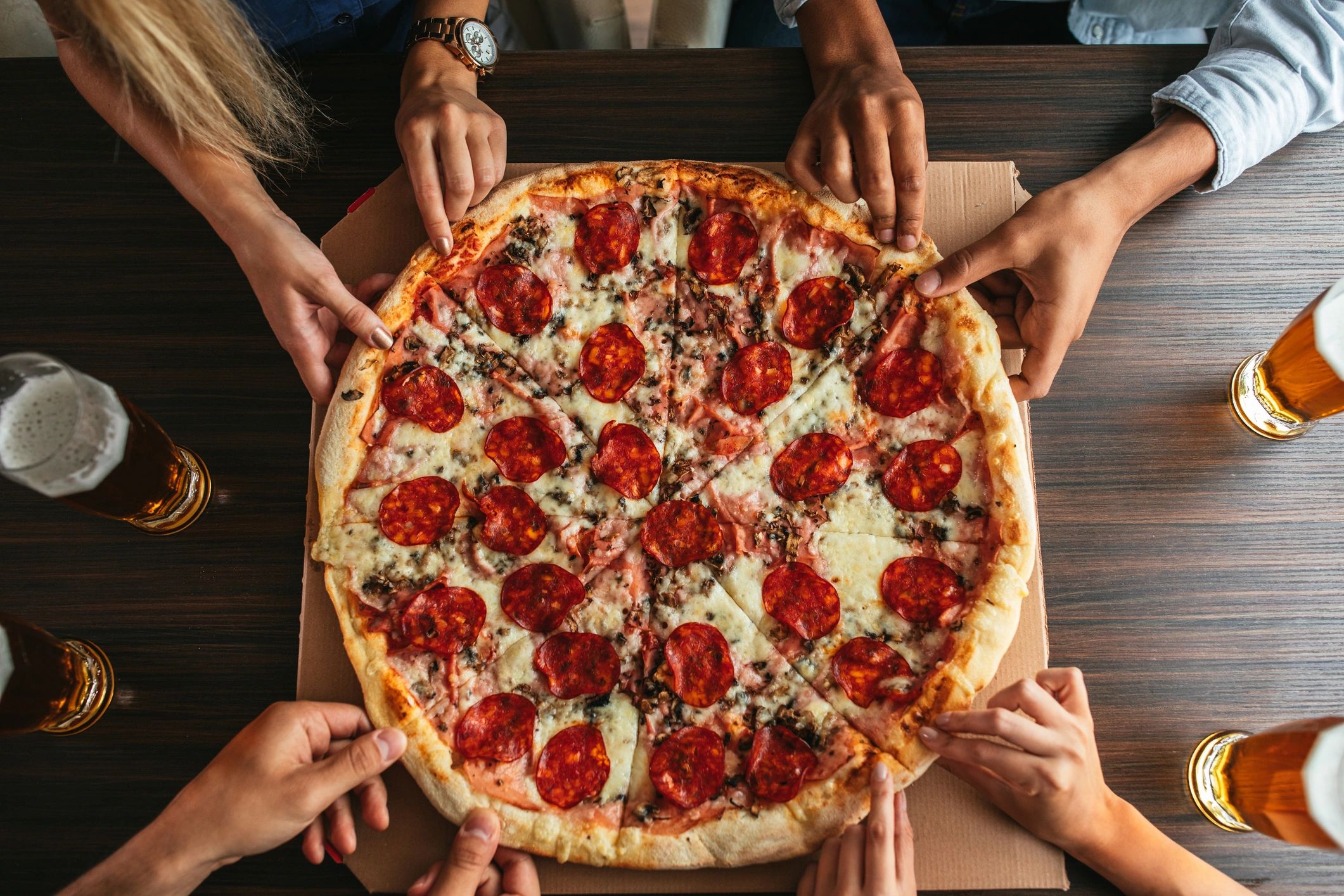 pizza on a table being shared