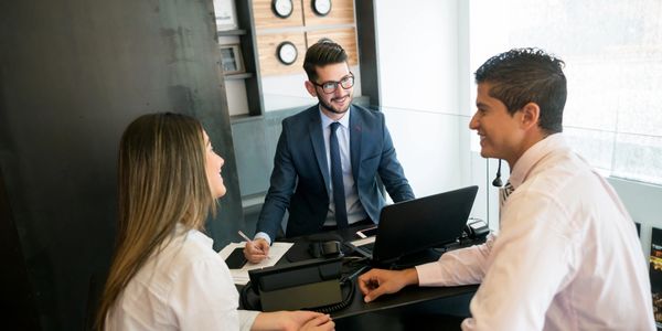 Three professionals having a positive business meeting in an office.