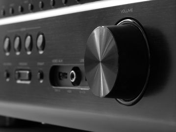 Close-up of a volume control knob on an audio amplifier.