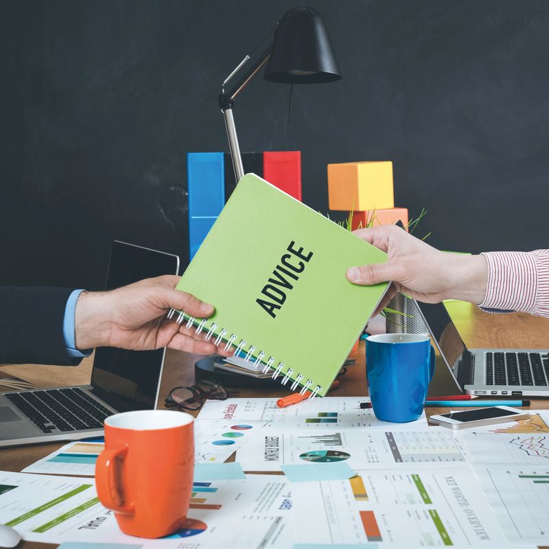 Man giving book which written Advice