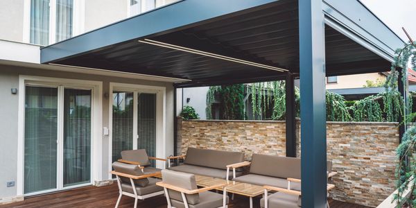 Timber pergola built to create a structured outdoor seating area.