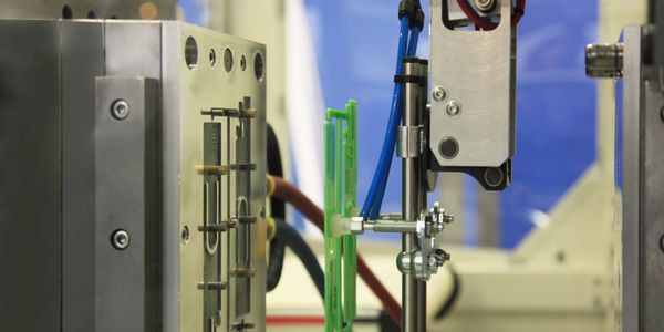 Production Mold running plastic parts for injection molding.