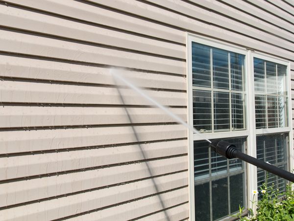 Power washing siding on a house in the Lehigh Valley