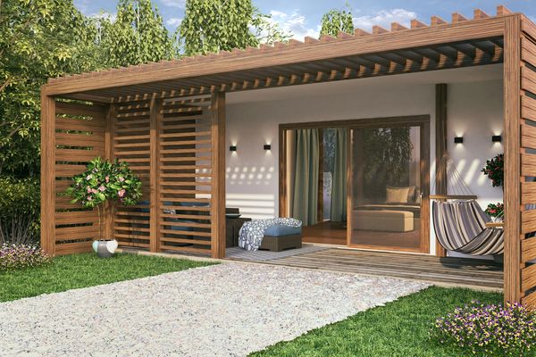 Modern wooden pergola patio with seating and hammock in a green garden.