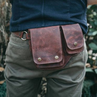 Men's leather fanny pack with belt for hiking or adventure travel. 