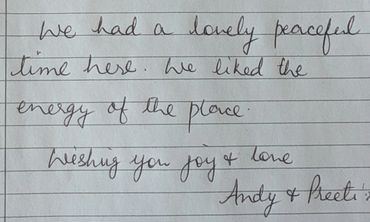 Handwritten note expressing a peaceful and joyful stay.