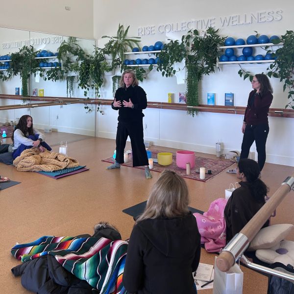 Breath Amigas instructor teaching breathing techniques during an in-person group class.