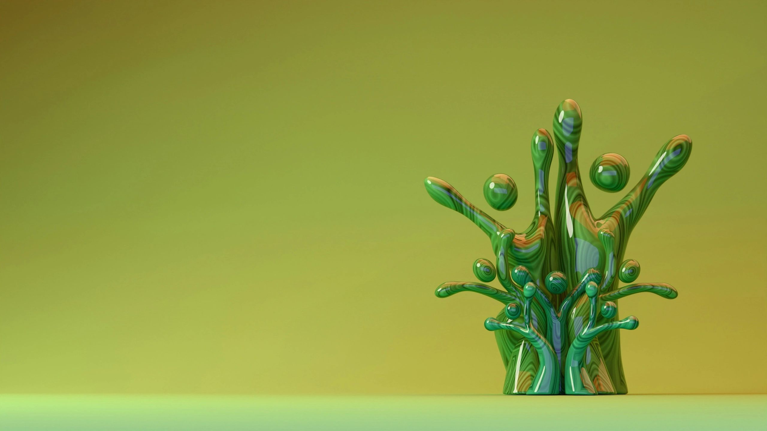 Green and orange liquid splash with glossy texture on green background.