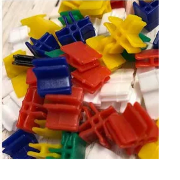 Popsicle stick connectors and craft clips used to connect craft sticks without glue