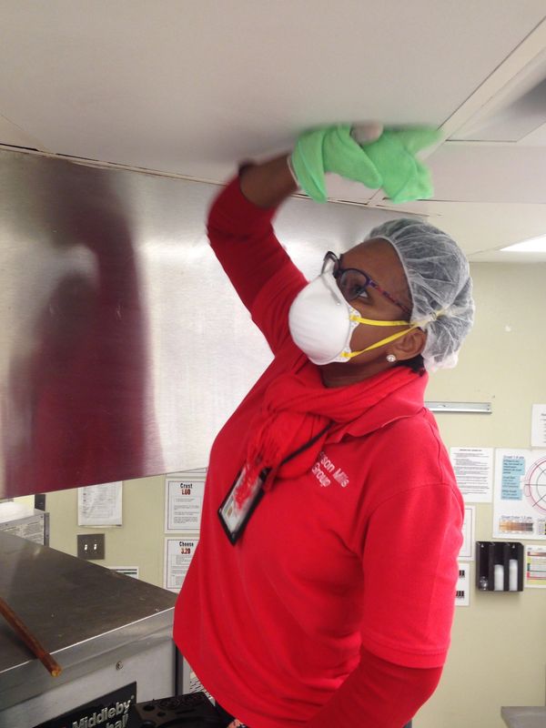 Cleaning Ceiling Tile at a Restaurant in Atlanta, Georgia.