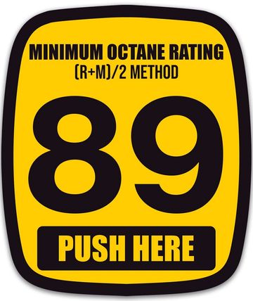 Yellow sign showing minimum octane rating 89 with push here instruction.