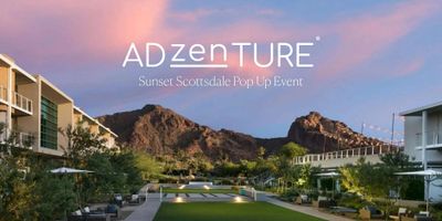 Sunset view of a Scottsdale pop-up event with mountains and modern buildings.