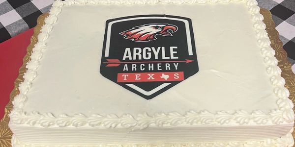 Cake with Argyle Archery Texas logo.