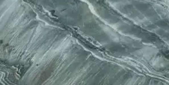 Close-up of textured, wavy gray marble surface.