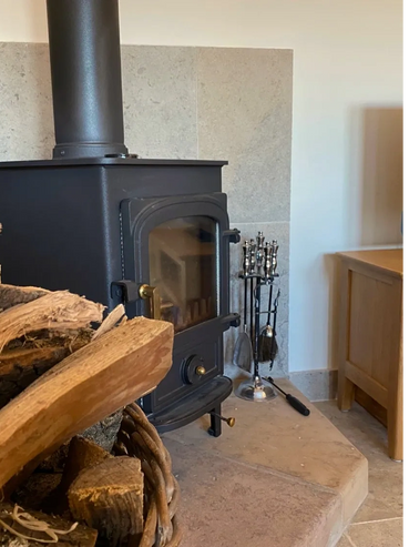 log burner fireplace in cottage 