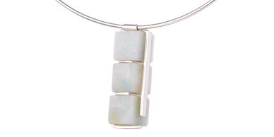 A vertical pendant of Andean Opal cubes set in silver