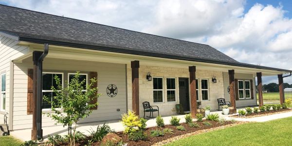Single-story house with black 6" k style seamless gutters