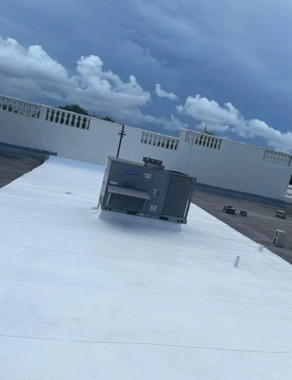 100% Silicone Roof Coating over the new roofing paper!