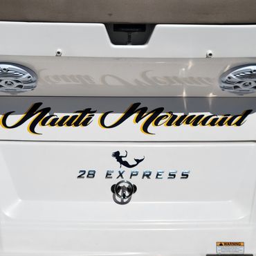 Boat deck with "Nauti" logo.