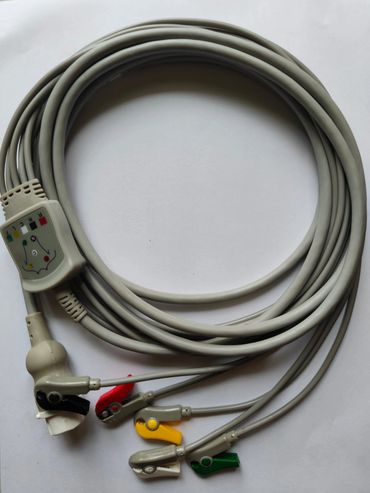 Medical ECG lead wires with color-coded clips coiled on a white background.