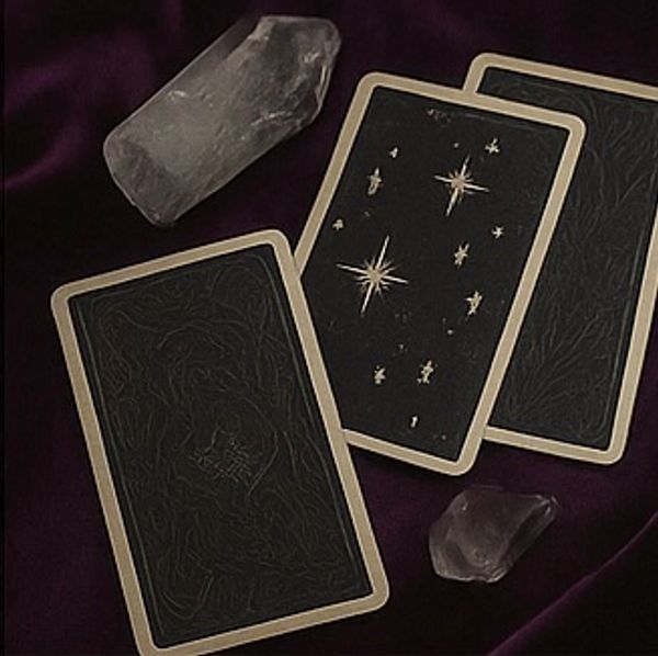 Tarot cards with clear quarts and amethyst crystals 