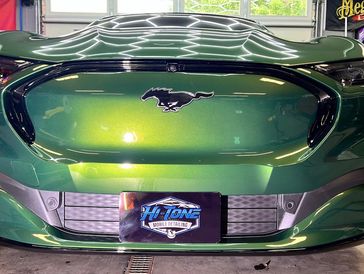 Brand new 2025 Mustang in the detail bay protected against the elements