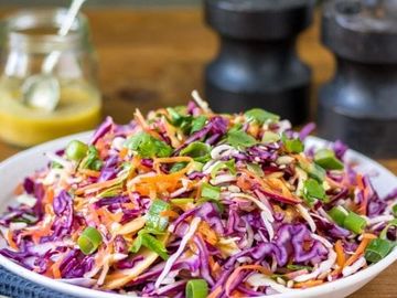 Crunch into freshness with our vibrant Cabbage Salad and zesty dressing.