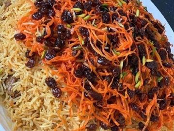 "Savor Afghan perfection: Qabuli Palaw – fragrant rice, tender meat, and exquisite spices