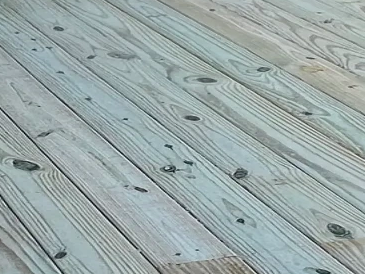 Close-up of wooden floorboards with natural grain and knots.