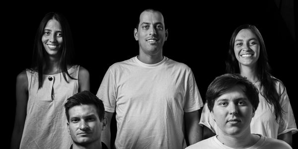 Black and white group portrait of five young adults with contrasting expressions.