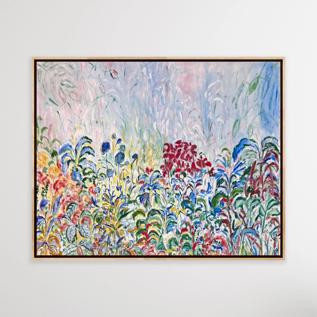 Colorful abstract floral painting in a wooden frame.