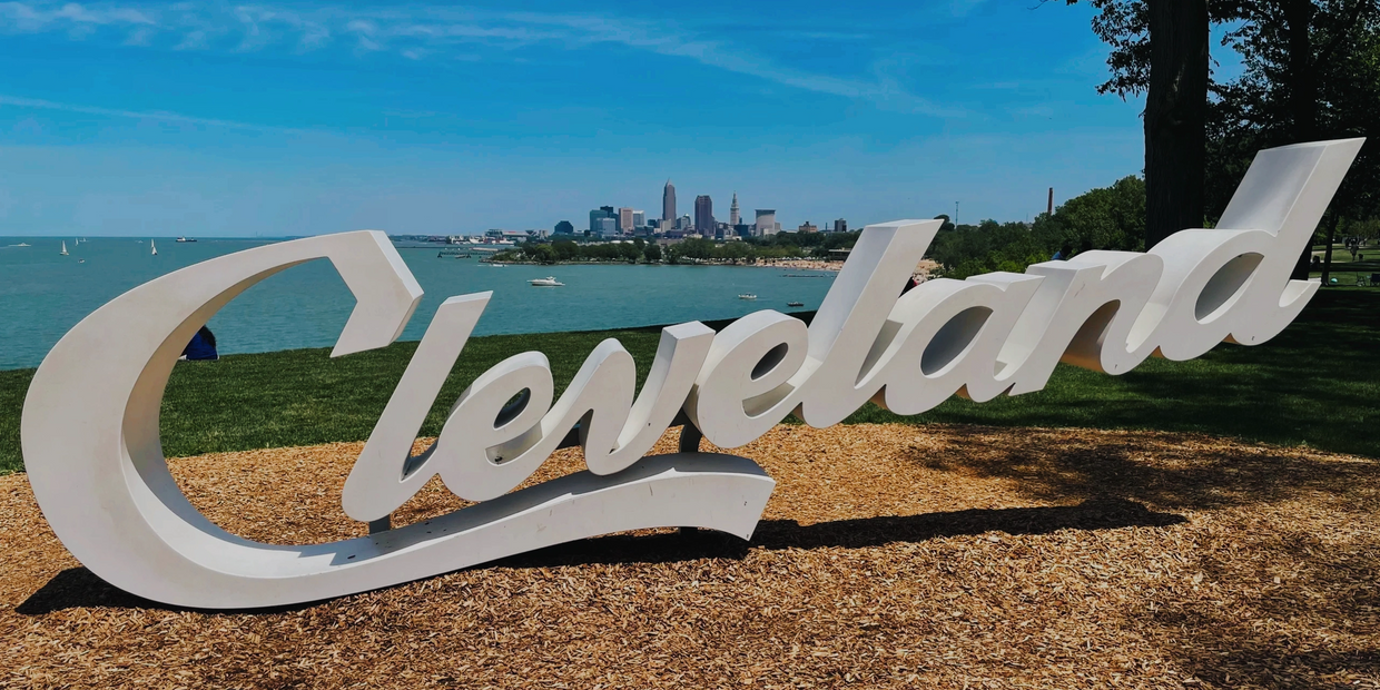 Cleveland, Ohio cursive sign overlooking Lake Erie and downtown Cleveland.