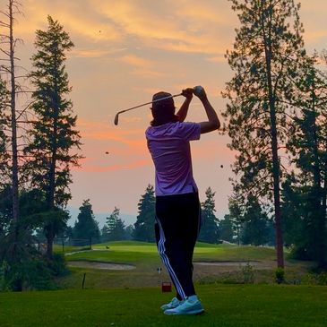 Lone golfer hitting off the tee