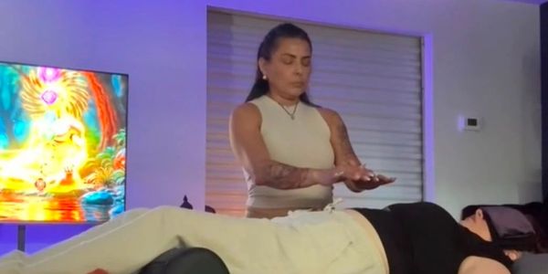 Kim Luague performing a Reiki session