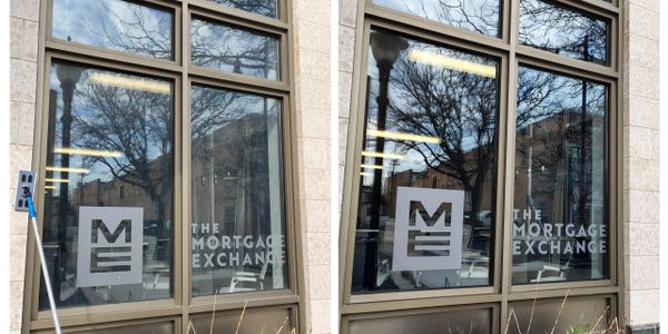 Glass window with The Mortgage Exchange logo and text.