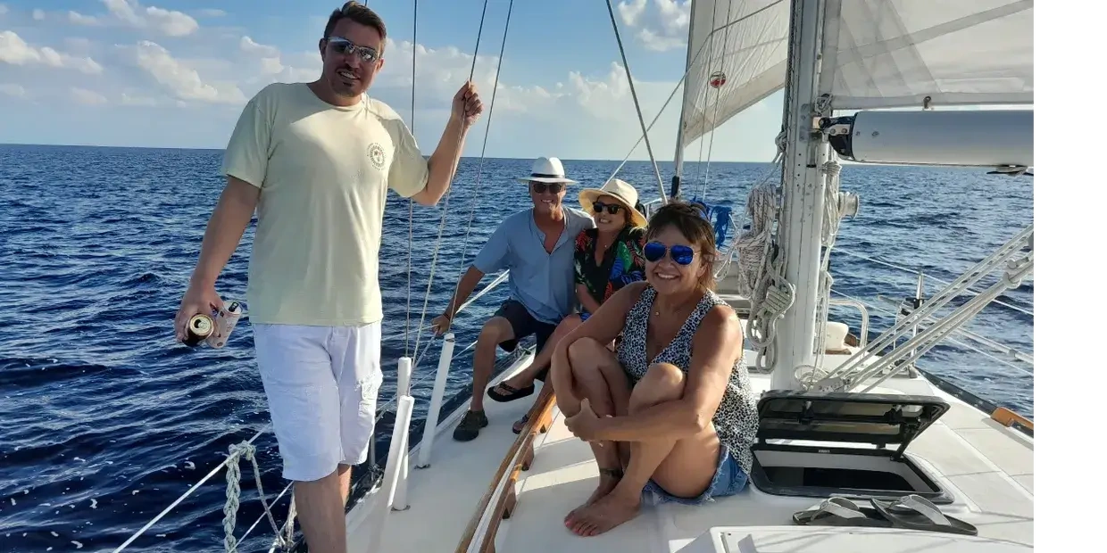 Friends enjoying a sailboat cruise on Charlotte Harbor near Sunseeker Resort