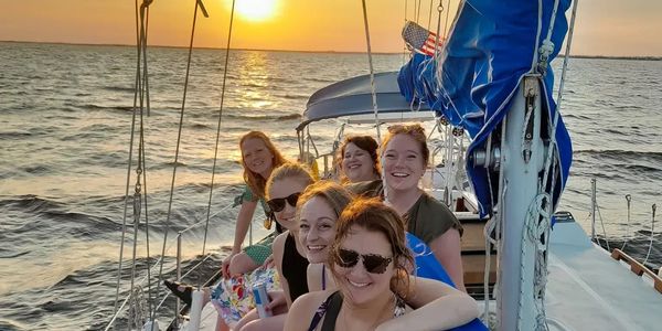 A group of women celebrating a bachelorette party on a sailboat cruise in Charlotte Harbor, Florida,